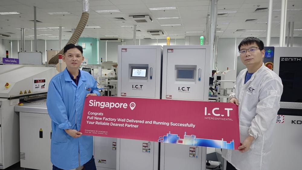 picture of people holding a banner in front of a machine 