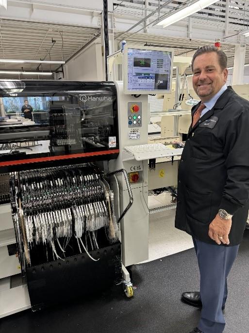 picture of person next to a p&P machine