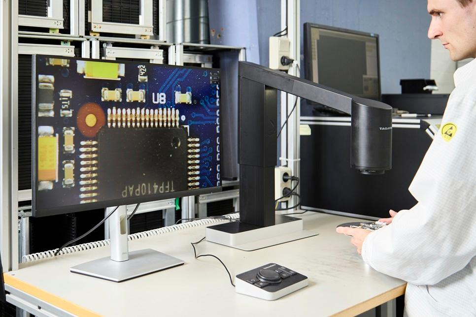picture of a man using a inspection machine